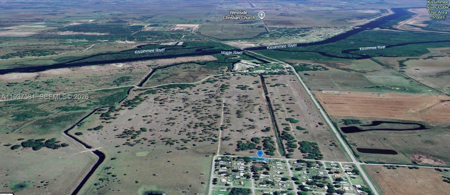This aerial map view shows a residential area near the Kissimmee River and rural land — 323 Jordan Ter, Okeechobee FL 34974, OKEECHOBEE, FL