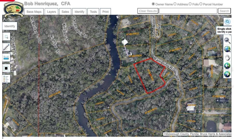 This is a satellite map showing a highlighted parcel of land near a river — 4876 RAMBLING RIVER ROAD, BRANDON, FL