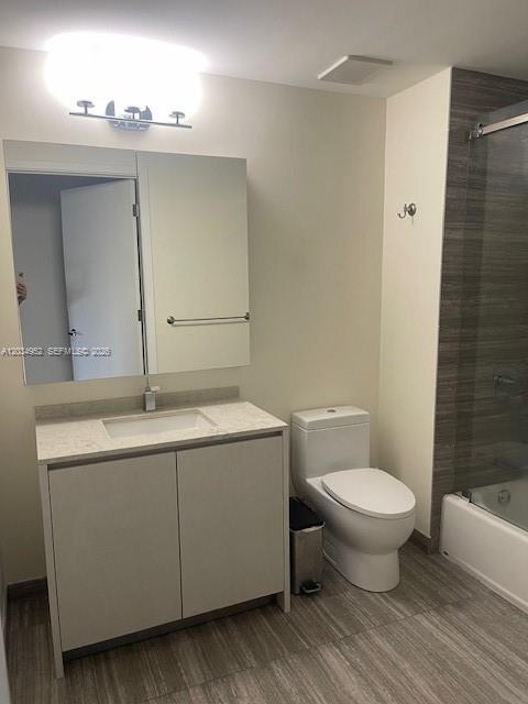 A modern bathroom features a vanity with a stone countertop, a toilet, and a shower — 1010 Brickell Ave # 3810, Miami FL 33131, MIAMI, FL