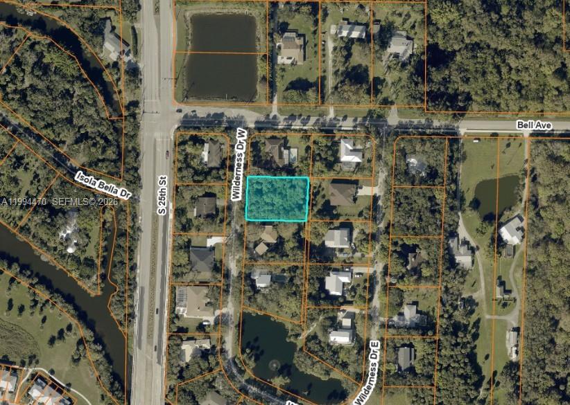 An aerial map view shows a vacant, rectangular lot highlighted in blue within a neighborhood — 3602 Wilderness Dr W, Fort Pierce FL 34982, FORT PIERCE, FL