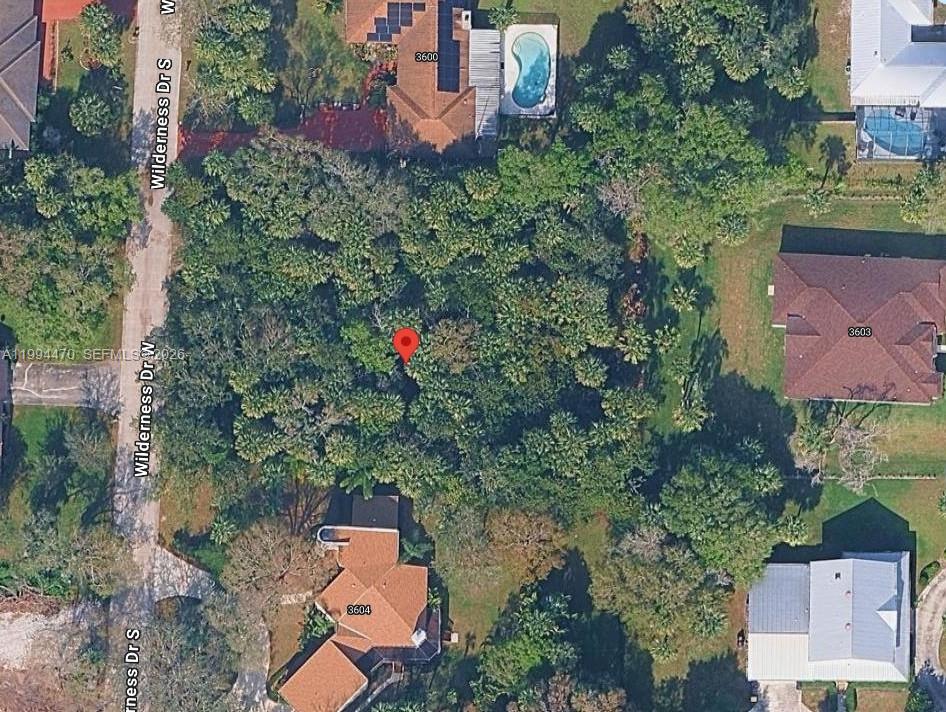 This is an aerial map view of a wooded residential lot — 3602 Wilderness Dr W, Fort Pierce FL 34982, FORT PIERCE, FL