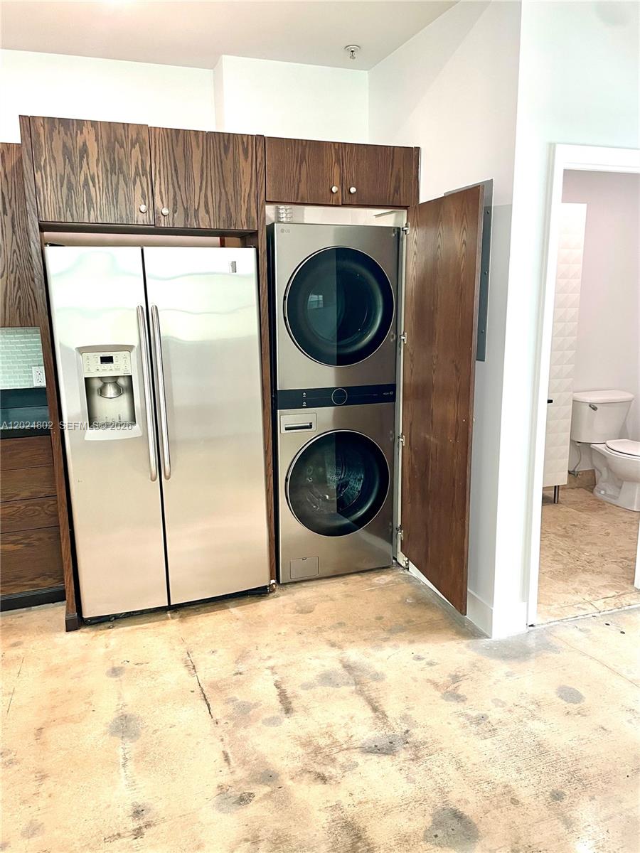 A white exterior door with a frosted glass panel and the number six sits beside a window — 935 Euclid Ave # 6, Miami Beach FL 33139, MIAMI BEACH, FL