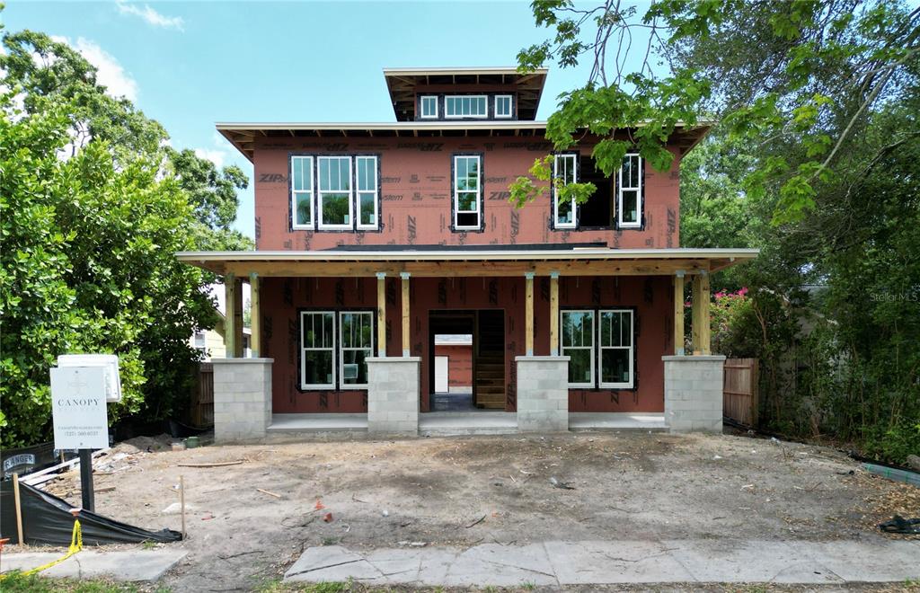 A two-story house under construction features a front porch with concrete block columns — 721 47TH AVENUE N, ST PETERSBURG, FL