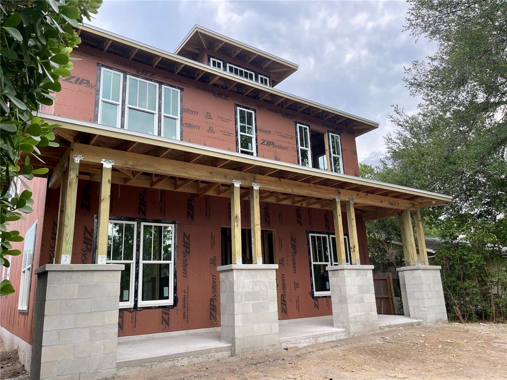 A two-story house under construction features a front porch with concrete block columns — 721 47TH AVENUE N, ST PETERSBURG, FL