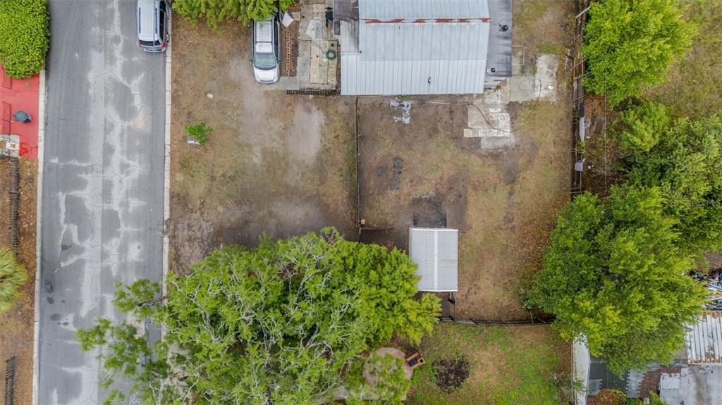 An aerial view shows a residential lot with a house, a shed, and two parked cars — 1127 ENGMAN STREET, CLEARWATER, FL