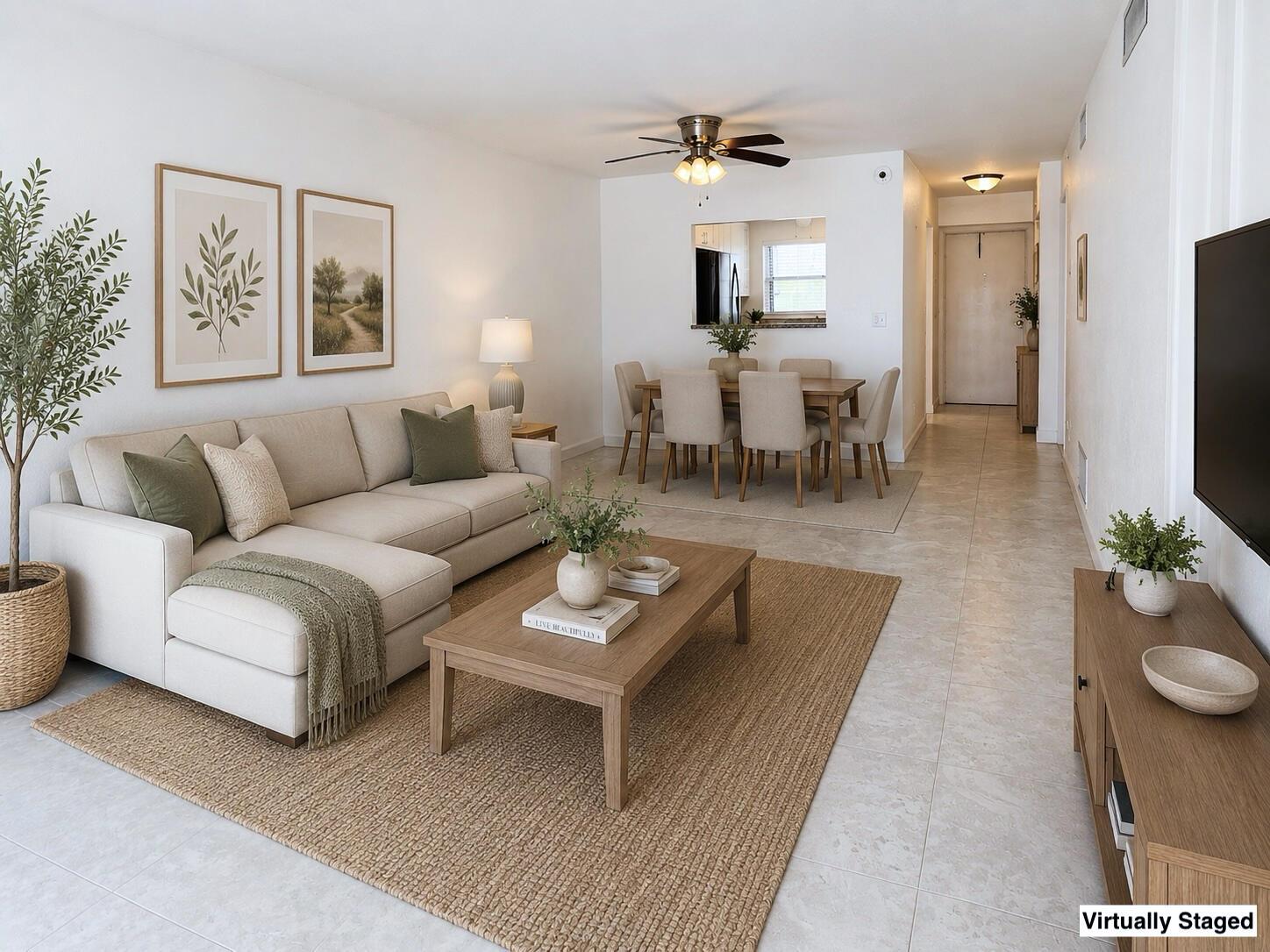 This virtually staged living and dining area features neutral furniture, tile floors, and beige rugs — 2016 S Federal Highway # 404, Boynton Beach FL 33435, BOYNTON BEACH, FL
