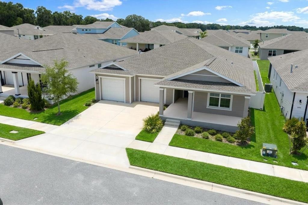 An aerial view of a single-story suburban house with a two-car garage and lawn — 6506 SW 75TH AVE ROAD, OCALA, FL
