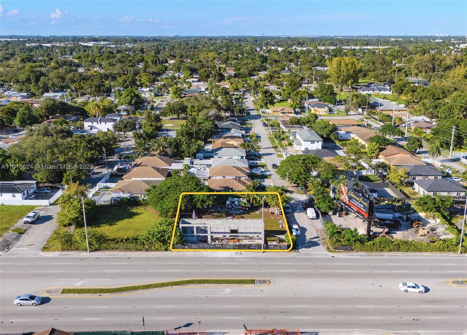 An aerial view shows a vacant lot with a concrete building frame outlined in yellow — 1441 NW 79th Street, Miami FL 33147, MIAMI, FL