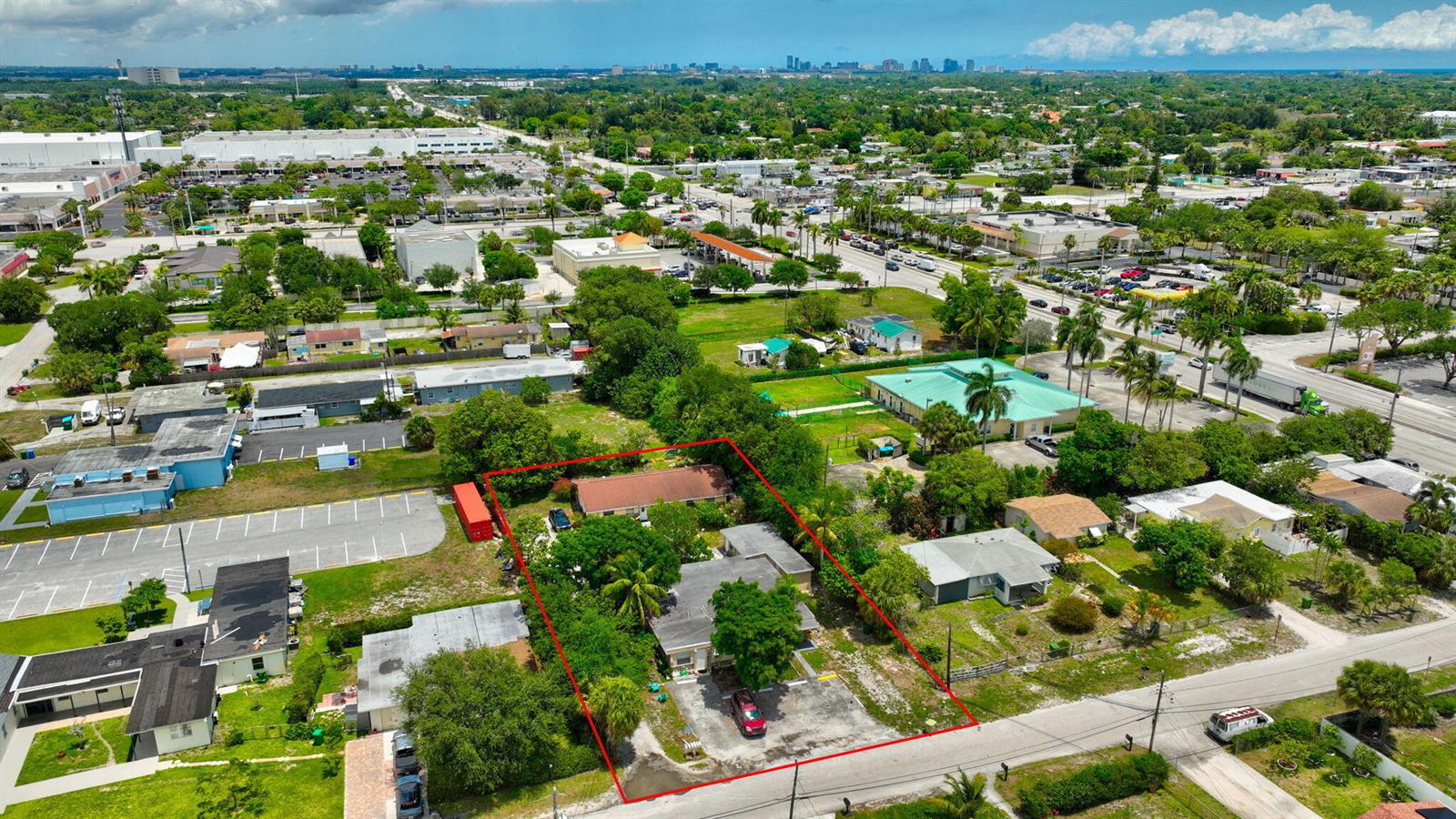 An aerial view shows a residential property outlined in red, featuring two buildings and trees — 3063 Floweva Street # A, West Palm Beach FL 33406, WEST PALM BEACH, FL