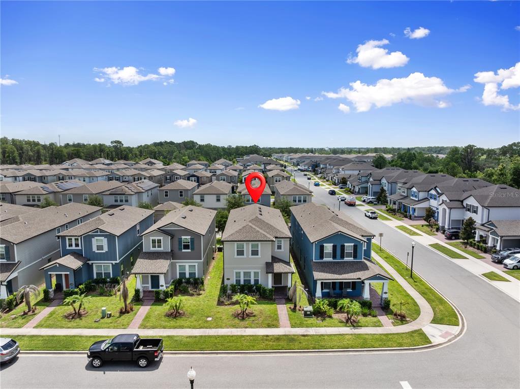 An aerial view shows a two-story suburban house marked with a red pin — 12597 ENCORE AT OVATION WAY, WINTER GARDEN, FL