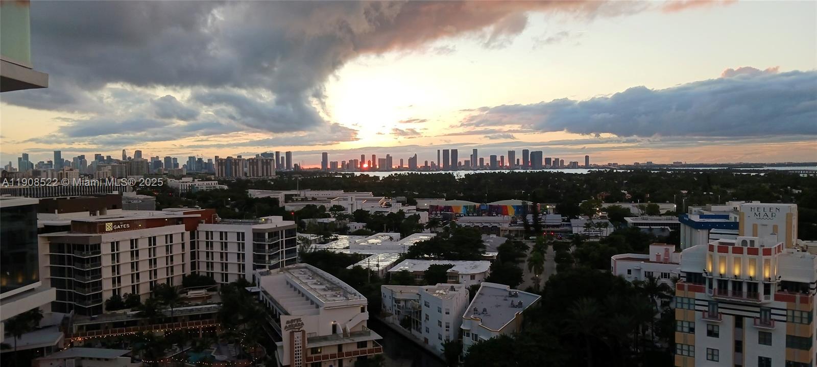 An elevated view of a city skyline at sunset over a suburban landscape — 2401 Collins Ave # 1708, Miami Beach FL 33140, MIAMI BEACH, FL