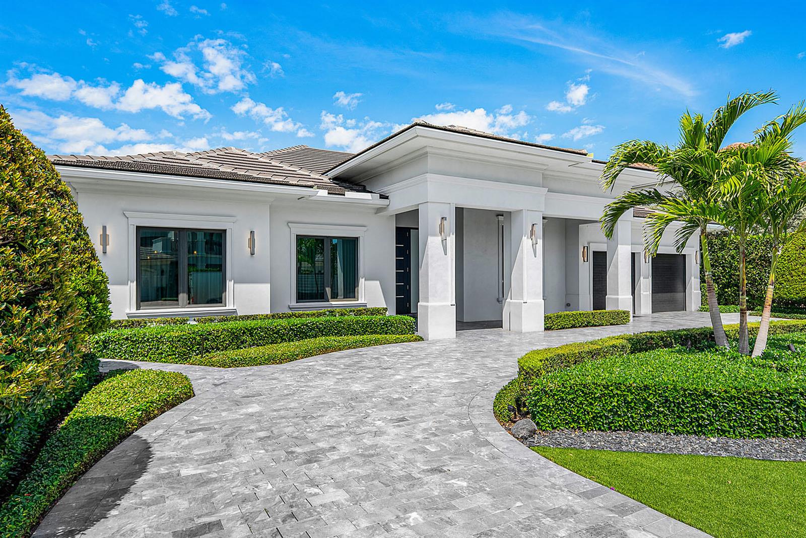 A white single-story house with a gray tiled roof and a paved circular driveway — 2351 Cherry Palm Road, Boca Raton FL 33432, BOCA RATON, FL