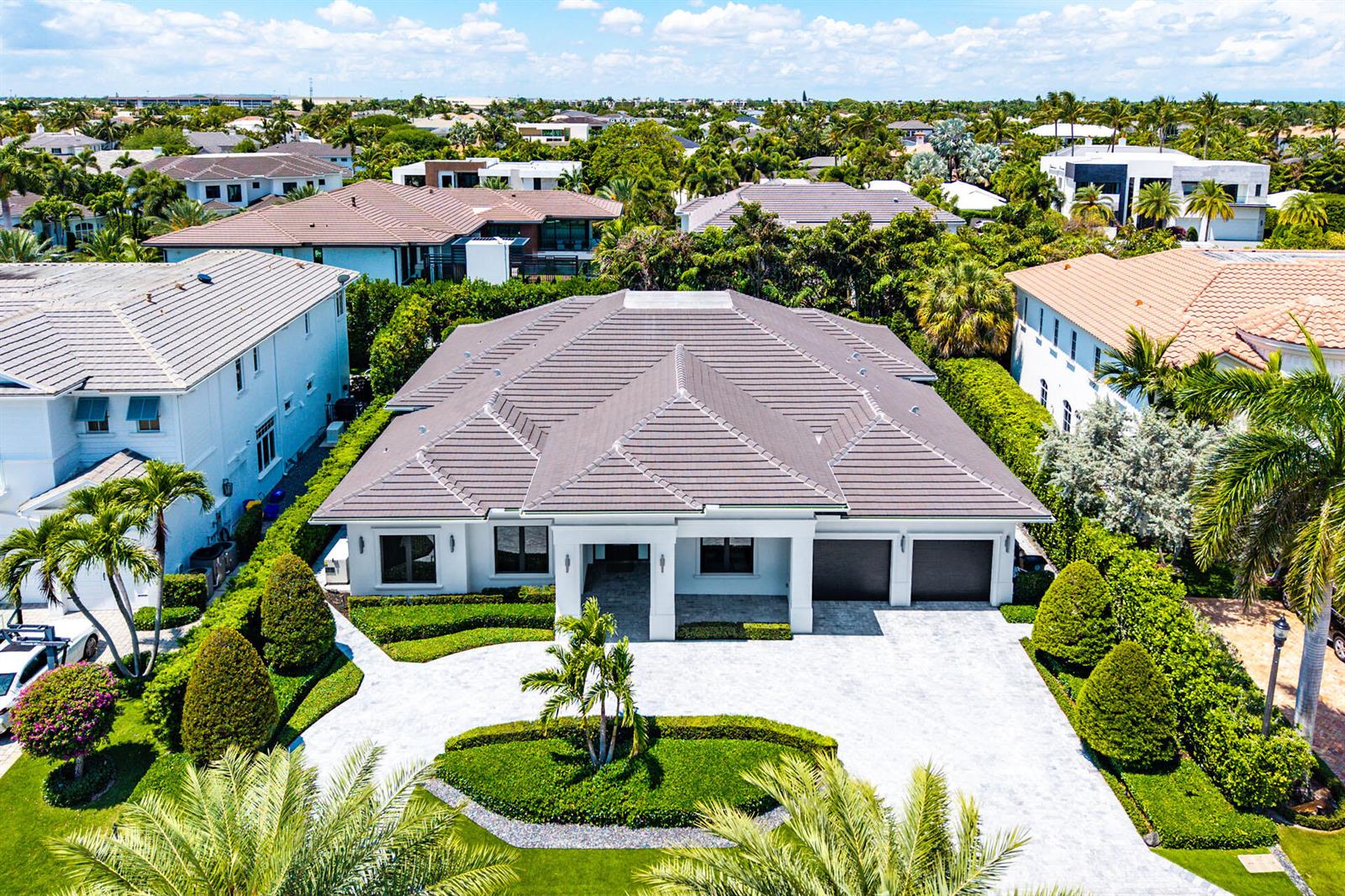 An aerial view of a single-story house with a tiled roof and a paved driveway — 2351 Cherry Palm Road, Boca Raton FL 33432, BOCA RATON, FL