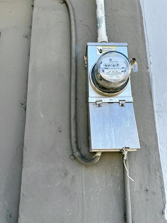 An outdoor electrical meter box is mounted on a painted concrete wall — 2024 LOIZA STREET, SAN JUAN, PR