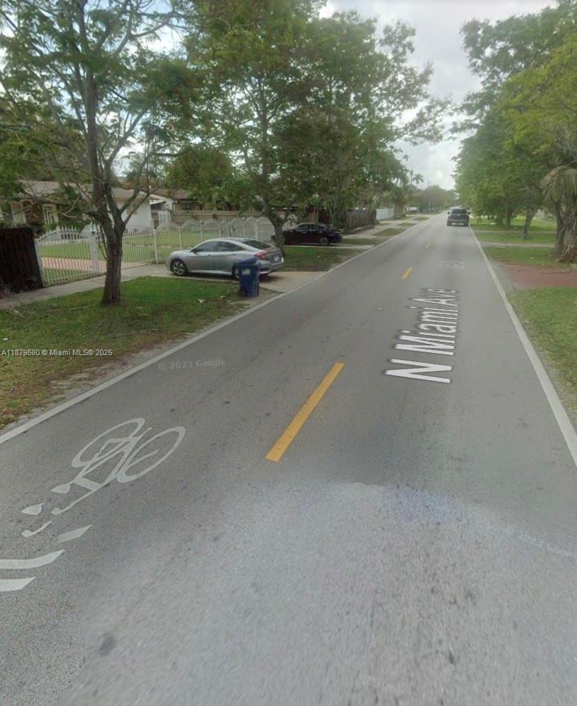 A street view shows a residential road with a bike lane and parked cars — 15505 N Miami Ave, Miami FL 33169, MIAMI, FL