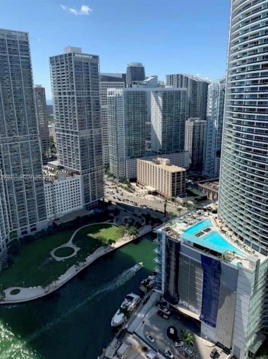 An elevated view of a Miami canal, park, and surrounding high-rise apartment buildings — 300 S Biscayne Blvd # 3701, Miami FL 33131, MIAMI, FL
