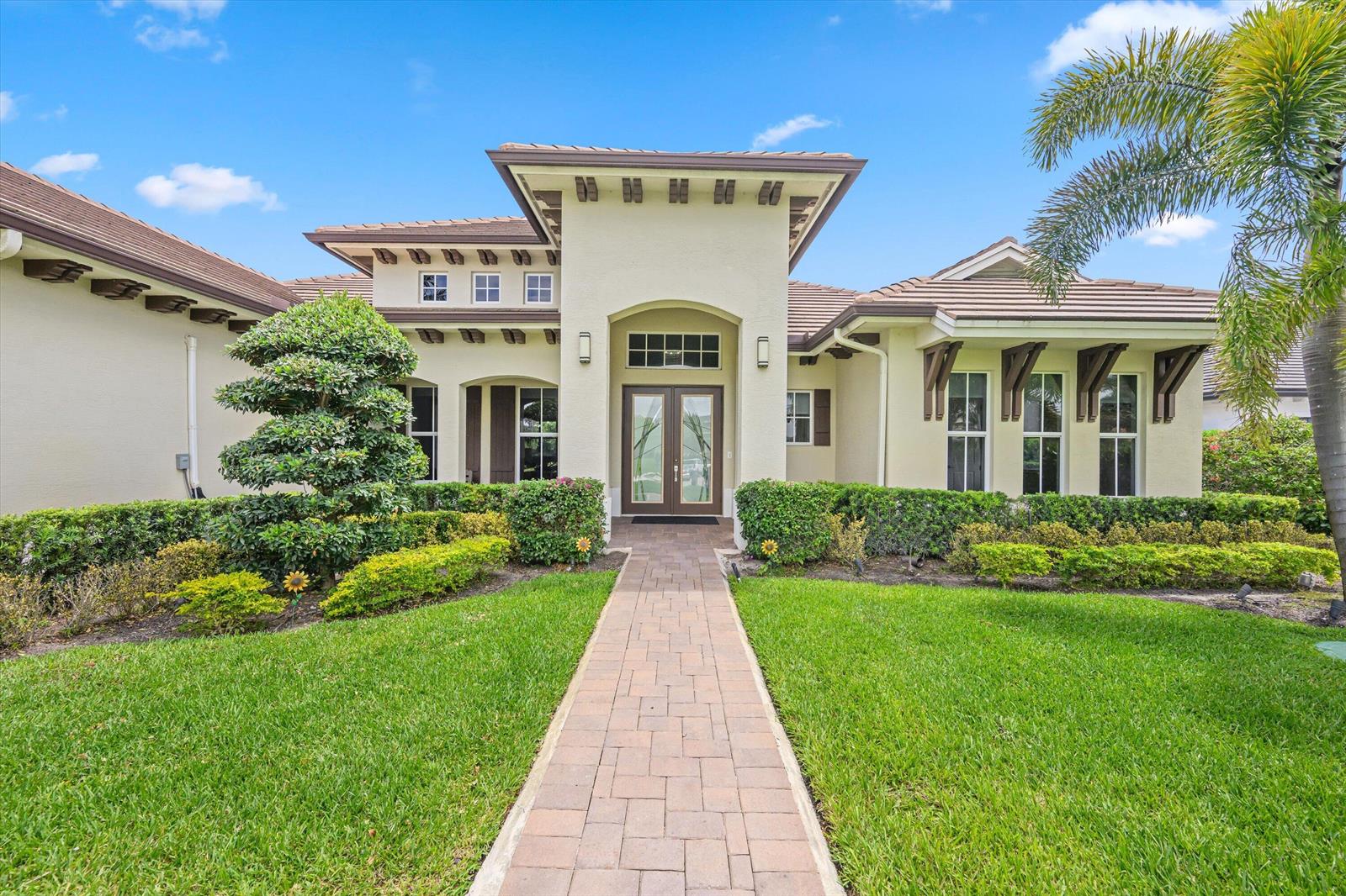 A single-story house with a paved walkway leading to a double-door entrance under a portico — 7336 Sisken Terrace, Lake Worth FL 33463, LAKE WORTH, FL