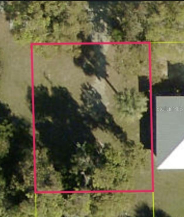 An aerial view shows a rectangular plot of land outlined in pink — 1849 PALM AVENUE, FORT MYERS, FL