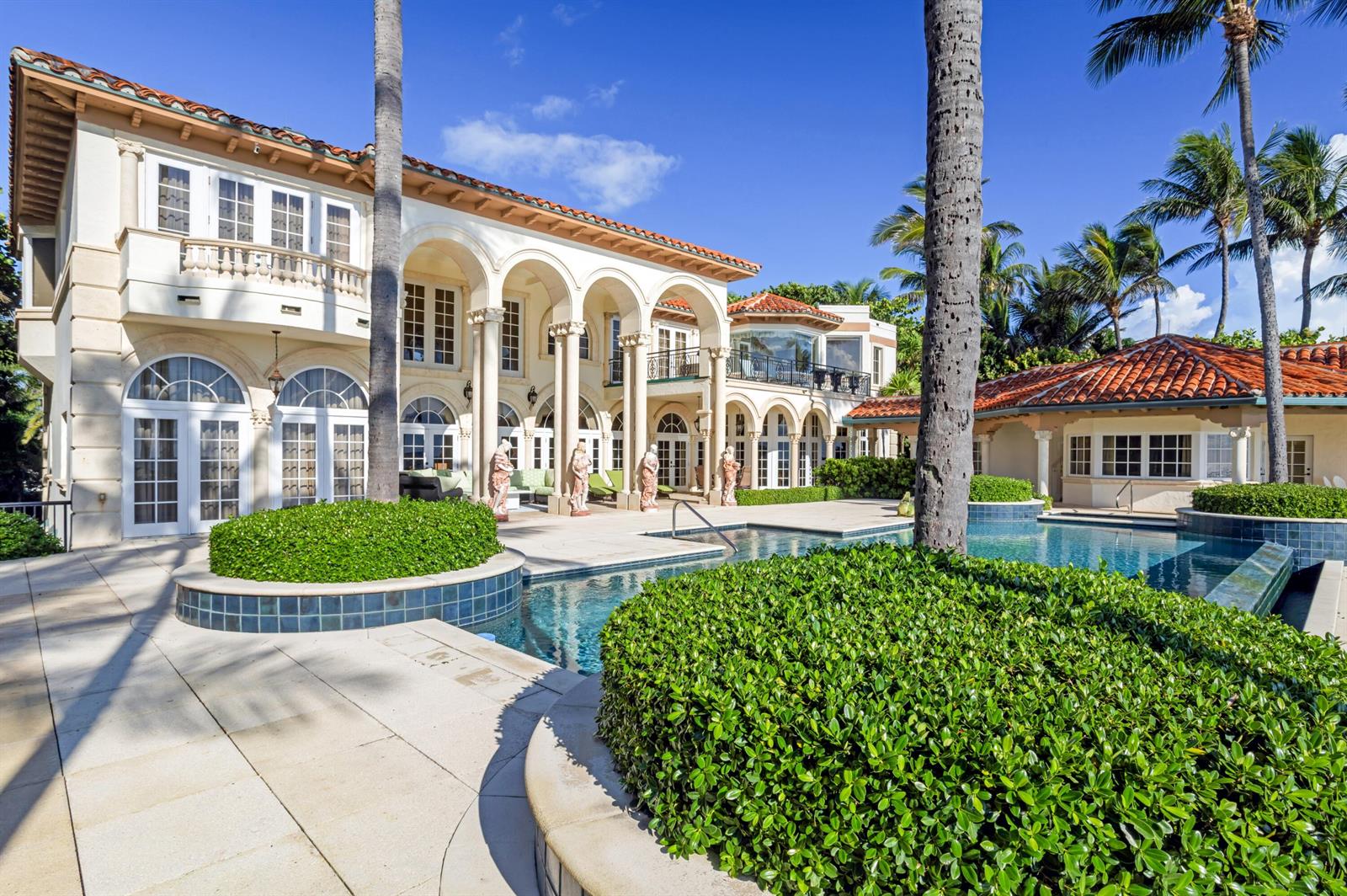 A large Mediterranean-style mansion with a pool, palm trees, and a tiled roof — 6133 N Ocean Boulevard, Ocean Ridge FL 33435, OCEAN RIDGE, FL