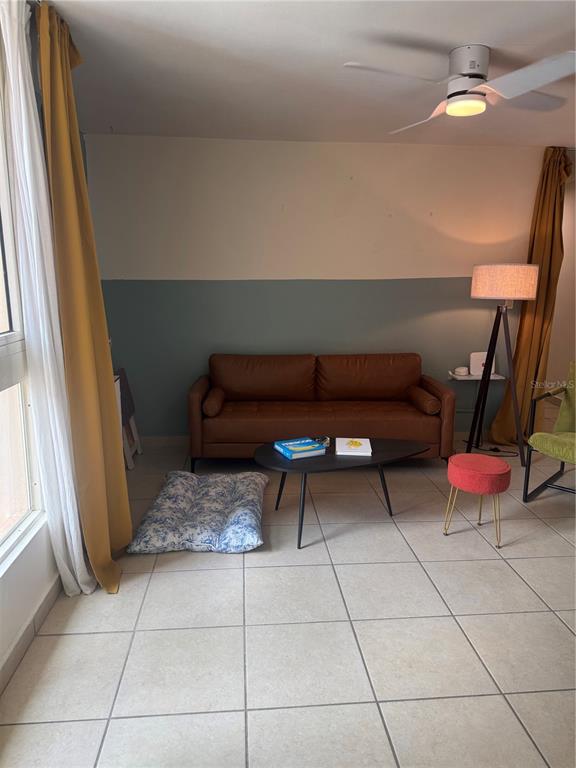 A living room features a brown leather sofa, a coffee table, and a floor lamp — 400 GRAN BLVD LOS PRADOS UNIT 6-201, CAGUAS, PR