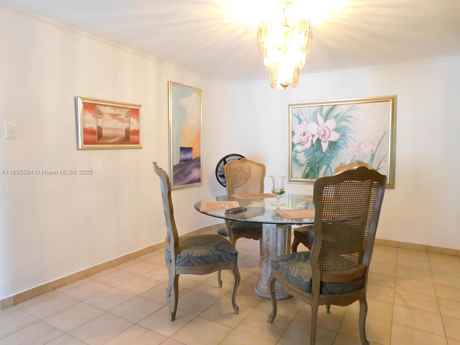 A dining room features a glass-topped table, four cane-back chairs, and three framed wall paintings — 77-53 57 Ave # 2, xx, xx