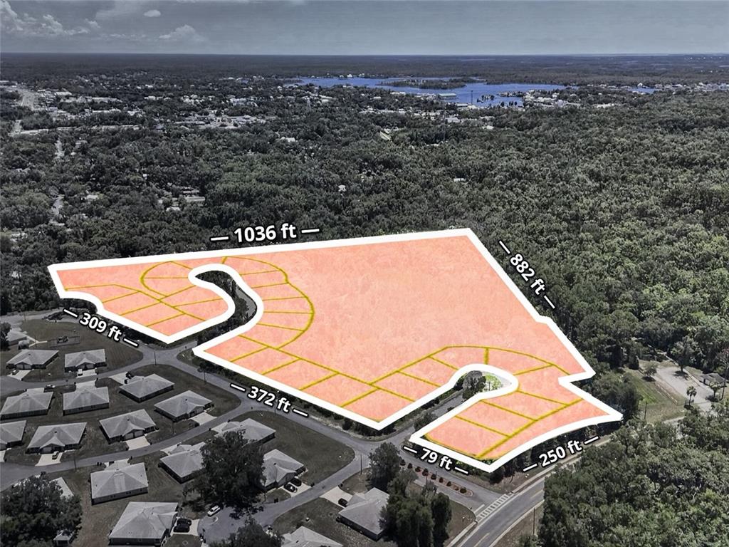 An aerial view shows a highlighted plot of land subdivided into residential building lots — 1520 NE 5TH AVENUE, CRYSTAL RIVER, FL