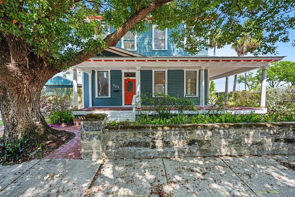 A two-story blue house with a red front door and a wrap-around porch — 501 W EUCLID AVENUE, TAMPA, FL