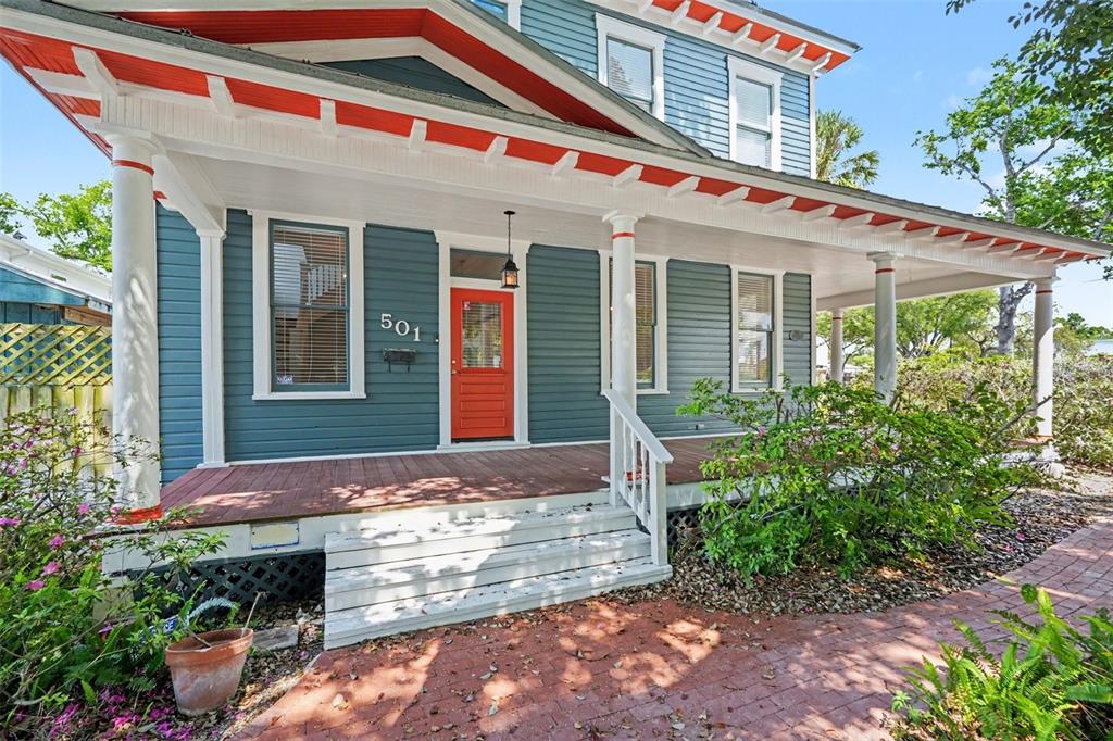 A blue house with a red front door and a covered porch with white columns — 501 W EUCLID AVENUE, TAMPA, FL