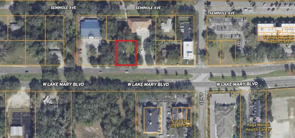 This is an aerial map showing a vacant, rectangular lot outlined in red near a road — 2698 W LAKE MARY BOULEVARD, LAKE MARY, FL