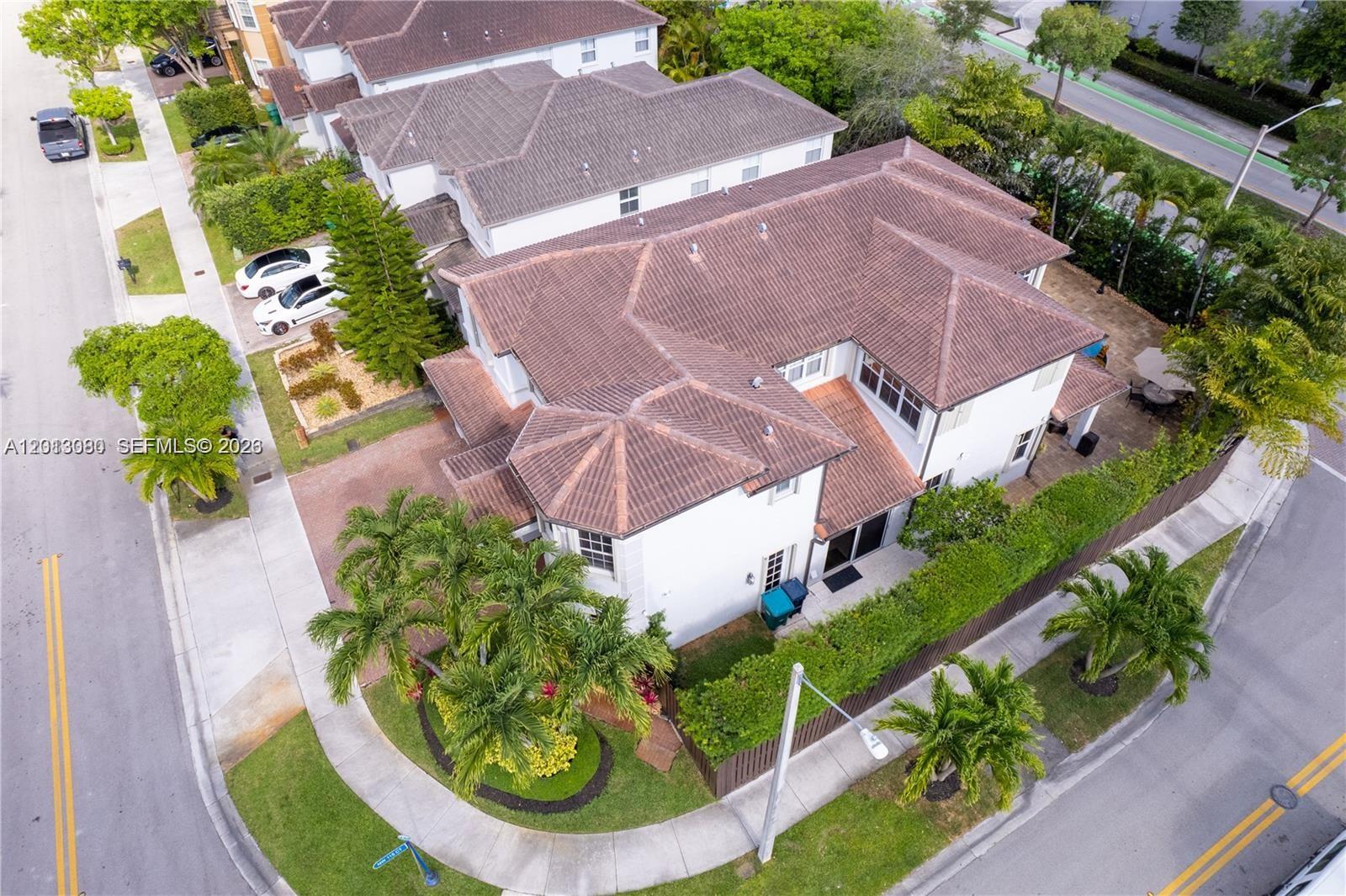 An aerial view shows a two-story house with a brown tiled roof and landscaping — 11530 NW 82nd Ter # 11530, Doral FL 33178, DORAL, FL