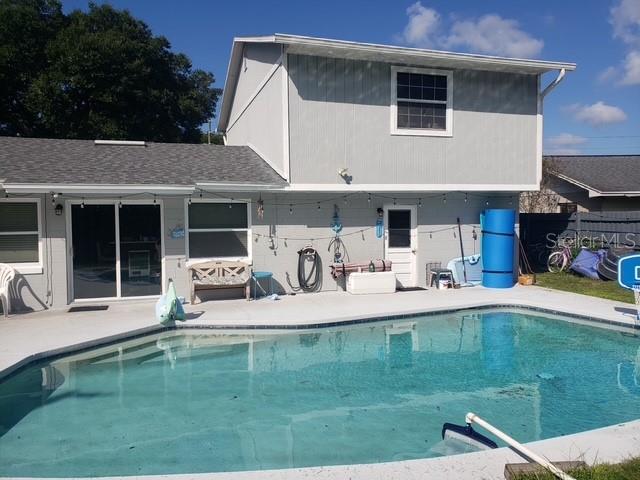 A two-story house exterior features a swimming pool in the backyard — 2054 EASTBROOK BOULEVARD, WINTER PARK, FL