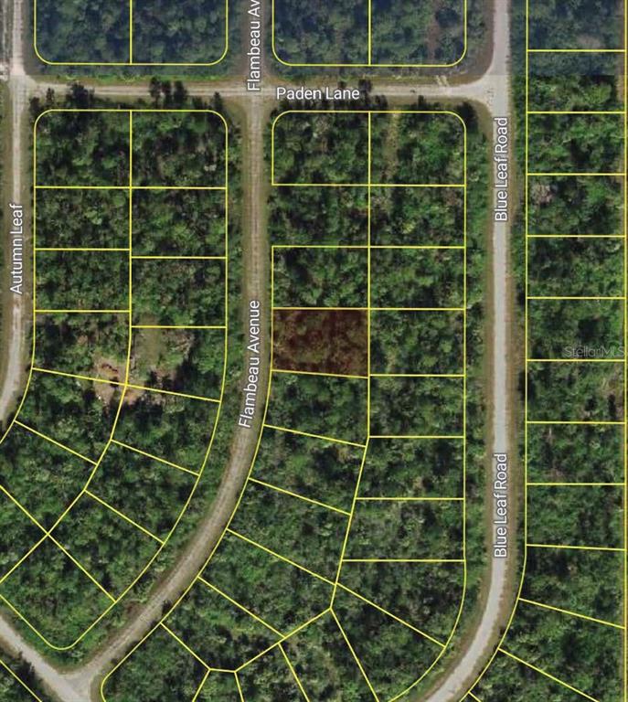 This is a map showing a vacant, wooded residential lot highlighted in a subdivision — FLAMBEAU AVENUE, NORTH PORT, FL
