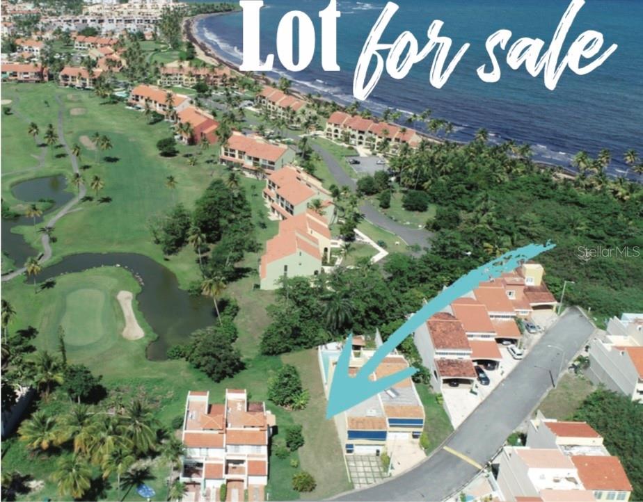 An aerial view shows a vacant residential lot situated between townhouses and a golf course — 145 MONTECARLO, HUMACAO, PR