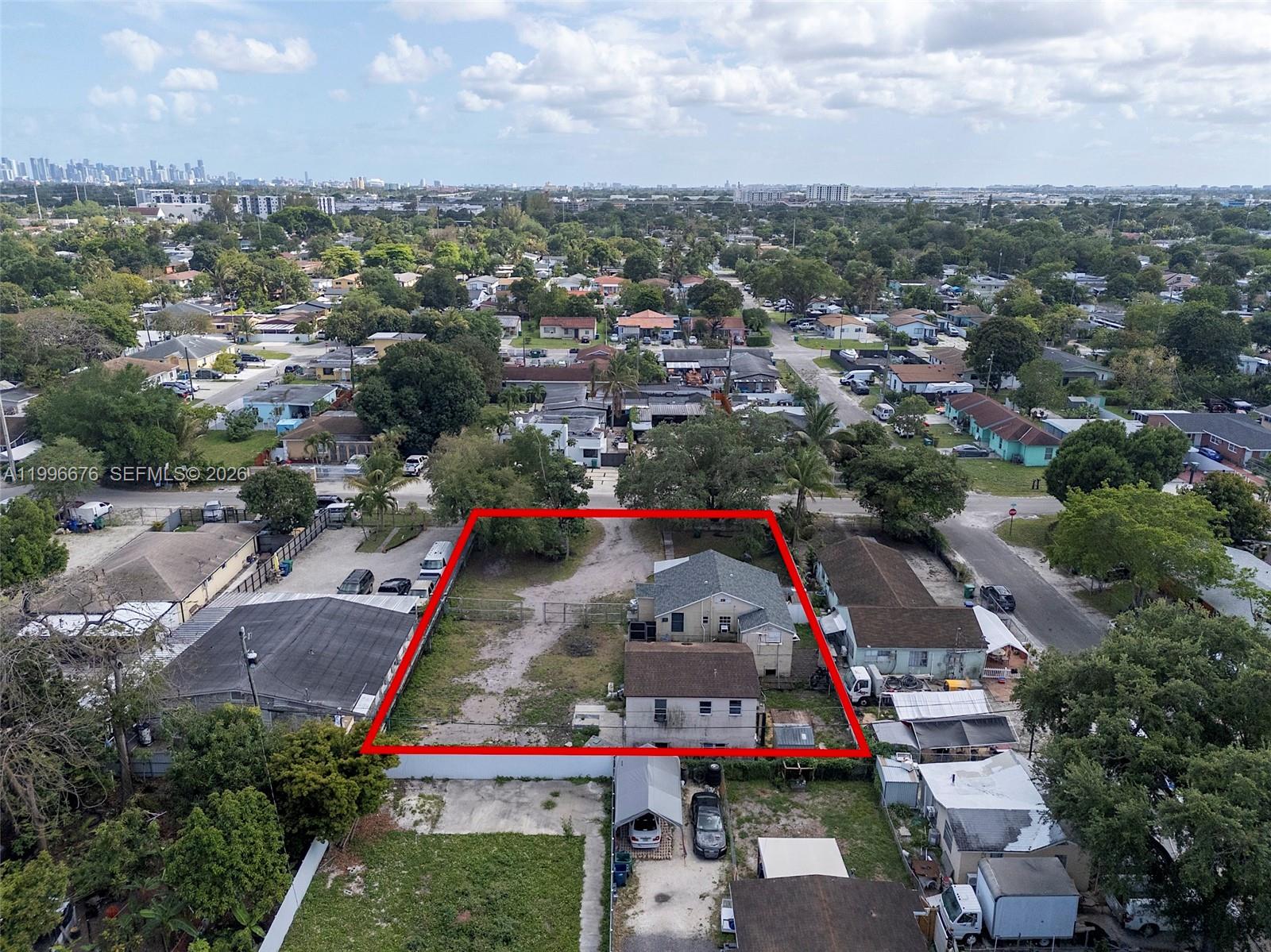 An aerial view shows a residential lot outlined in red with two houses and trees — 3035 NW 93rd St, Miami FL 33147, MIAMI, FL