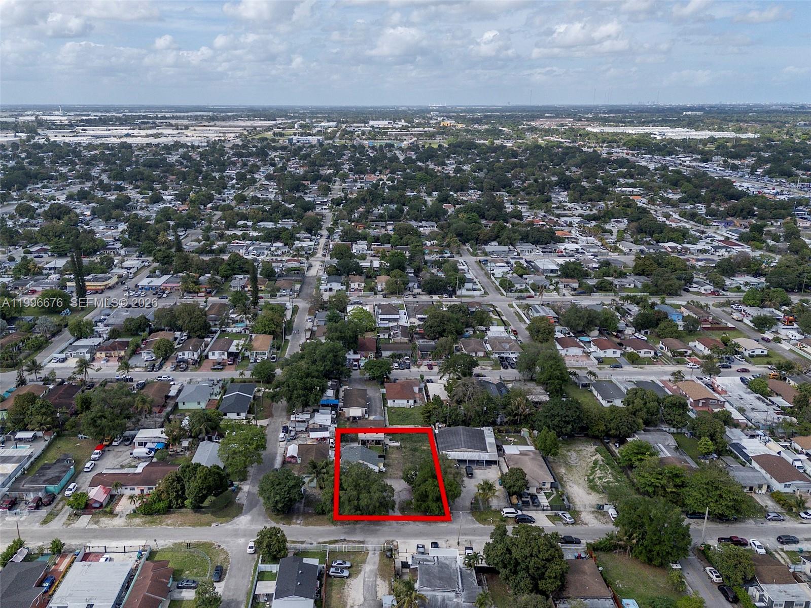 An aerial view shows a rectangular residential lot outlined in red within a suburban neighborhood — 3035 NW 93rd St, Miami FL 33147, MIAMI, FL