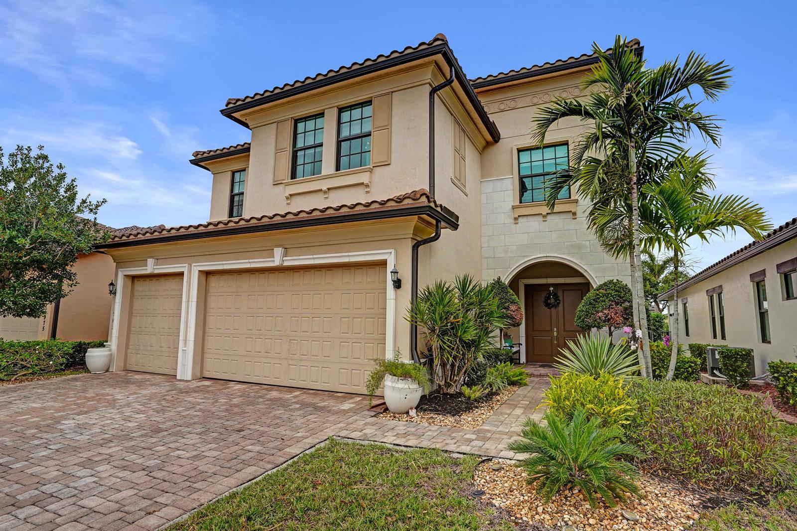 An aerial view of a suburban neighborhood featuring houses along a lake — 11965 S Baypoint Circle, Parkland FL 33076, PARKLAND, FL