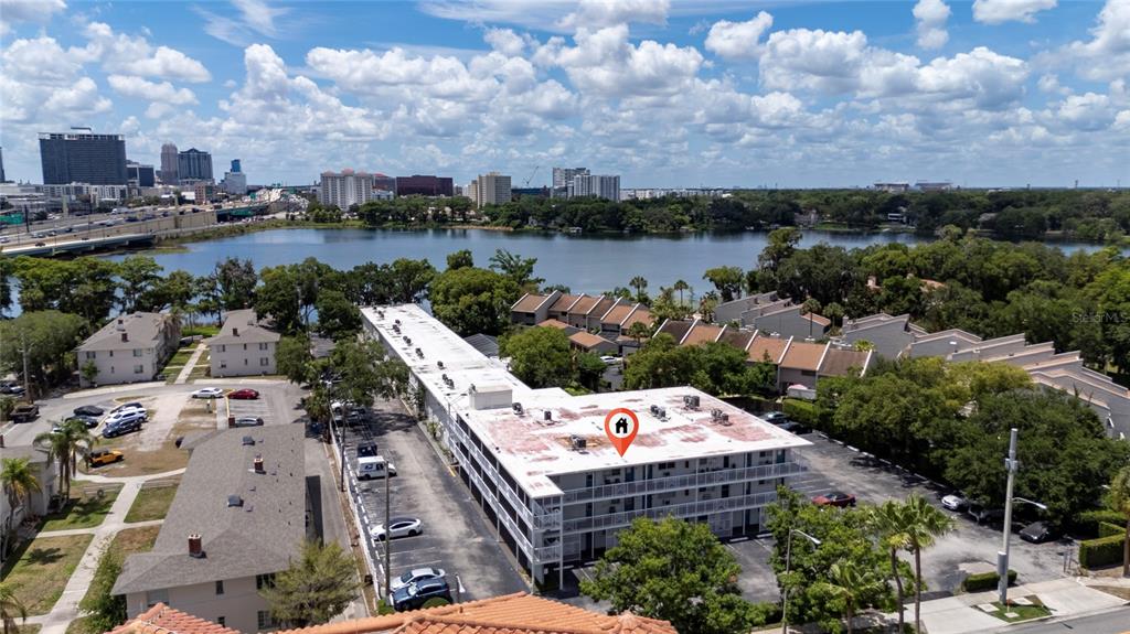 An aerial view shows a multi-story apartment building with a flat roof and parking lot — 320 LAKEVIEW STREET UNIT 323, ORLANDO, FL
