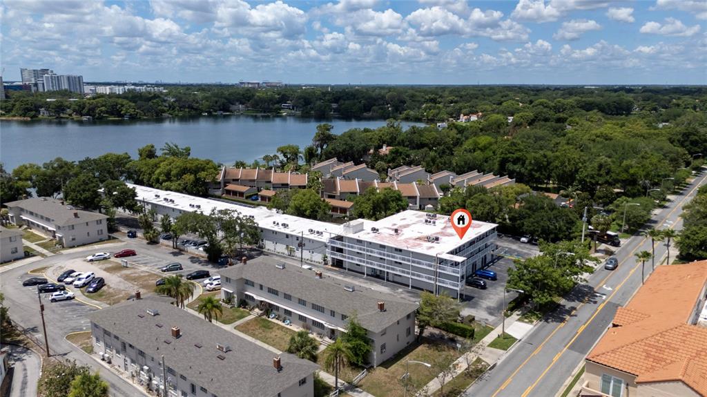 An aerial view shows apartment buildings near a lake with a red location pin — 320 LAKEVIEW STREET UNIT 323, ORLANDO, FL