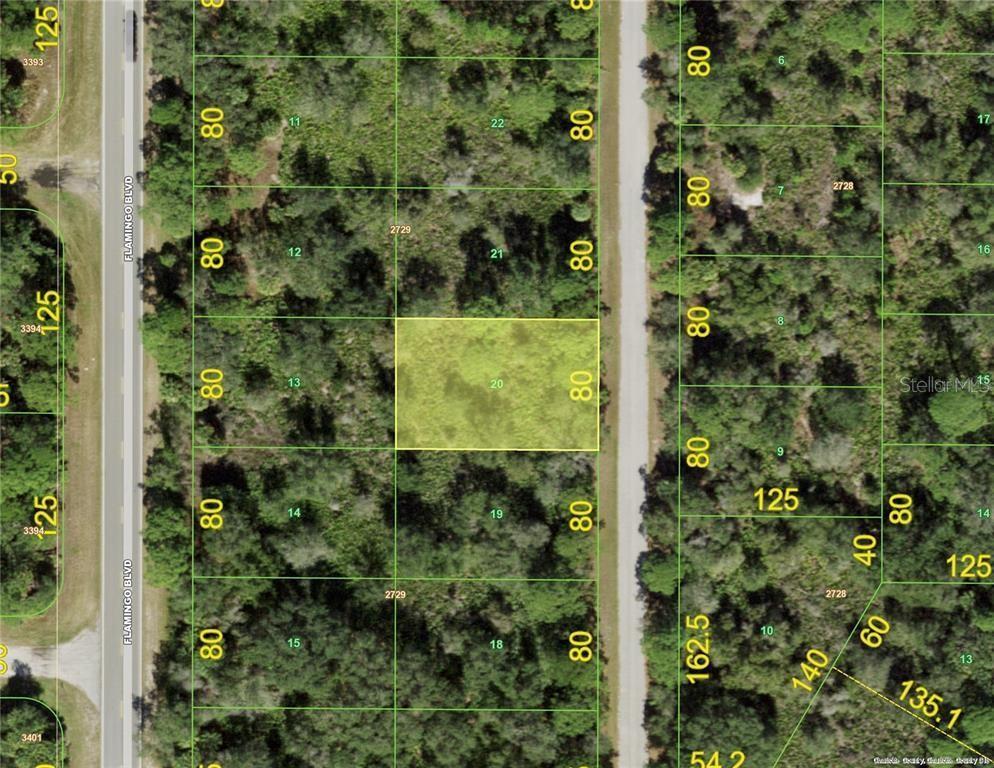 This is an aerial map showing a highlighted rectangular land parcel among surrounding wooded lots — 3137 CALEXICO STREET, PORT CHARLOTTE, FL