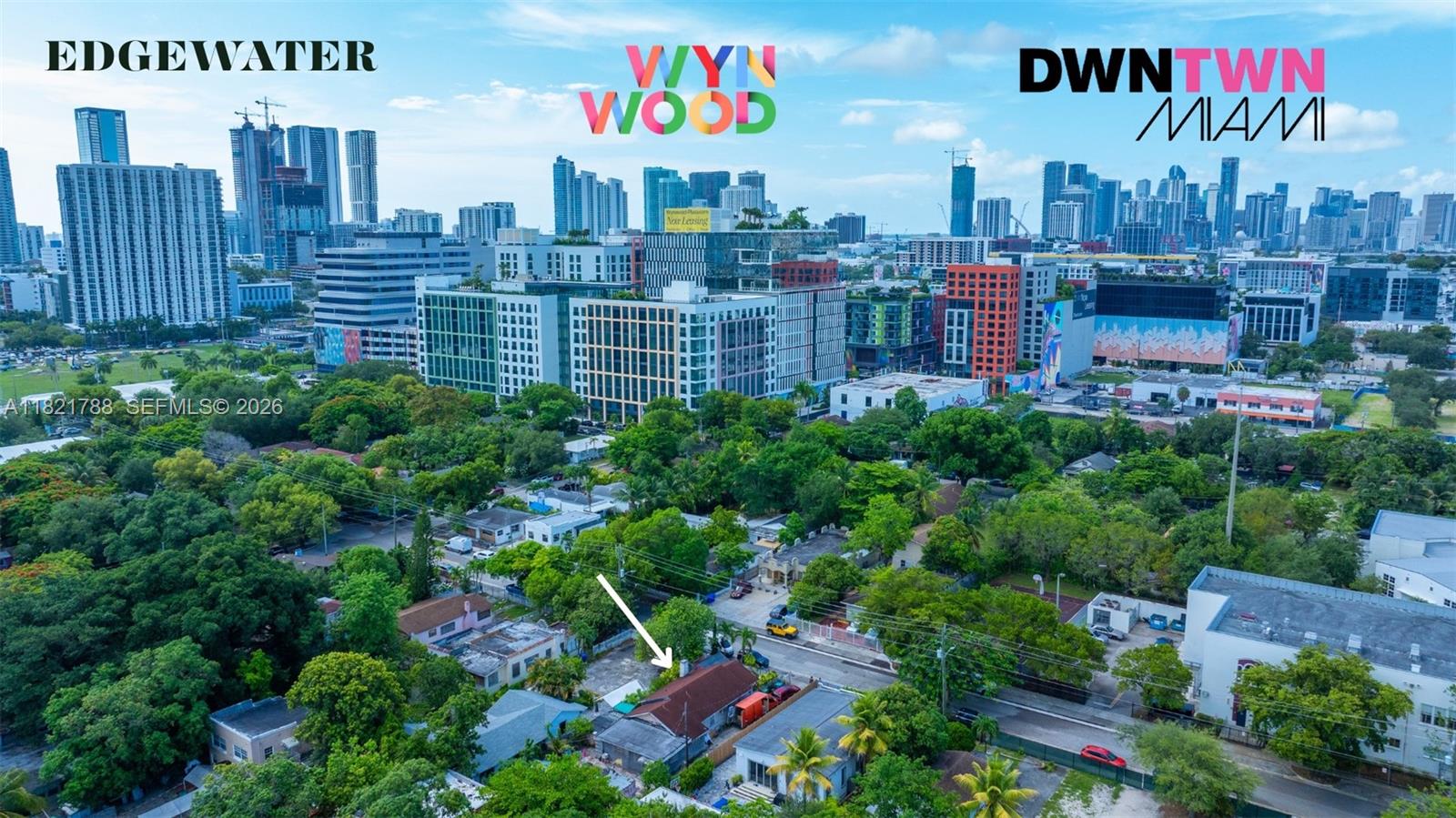 An aerial view shows a single-story house with a white arrow pointing to its roof — 145 NW 31st St, Miami FL 33127, MIAMI, FL