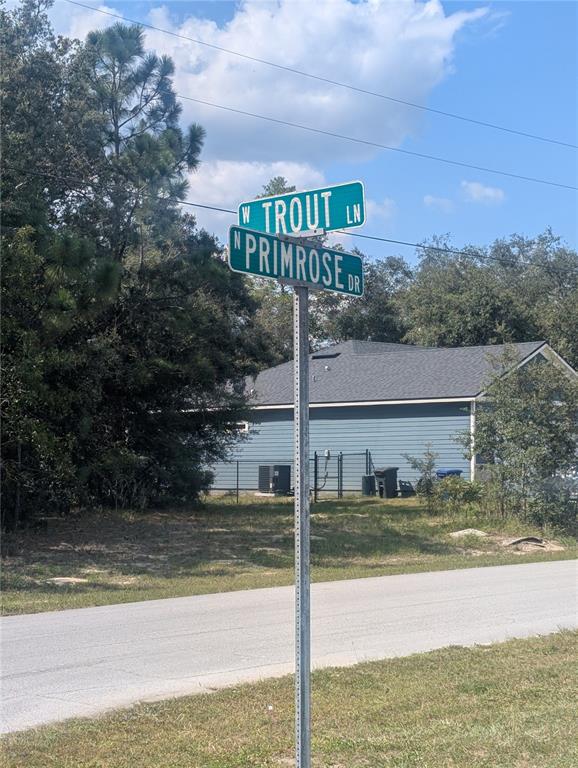 A street sign at the intersection of W Trout Ln and N Primrose Dr — 8010 N PRIMROSE DRIVE, CITRUS SPRINGS, FL
