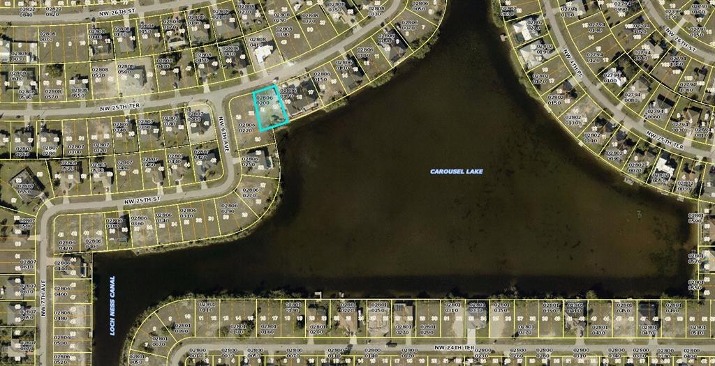 This is an aerial map showing a vacant lot highlighted in blue near a lake — 538 NW 25TH TERRACE, CAPE CORAL, FL