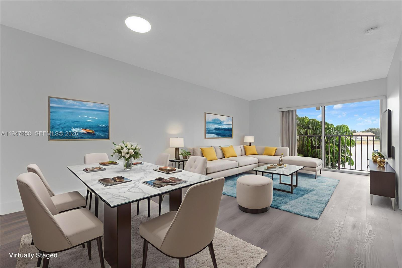 This virtually staged living and dining room features light wood floors and a balcony view — 8560 N Sherman Cir # 208, Miramar FL 33025, MIRAMAR, FL