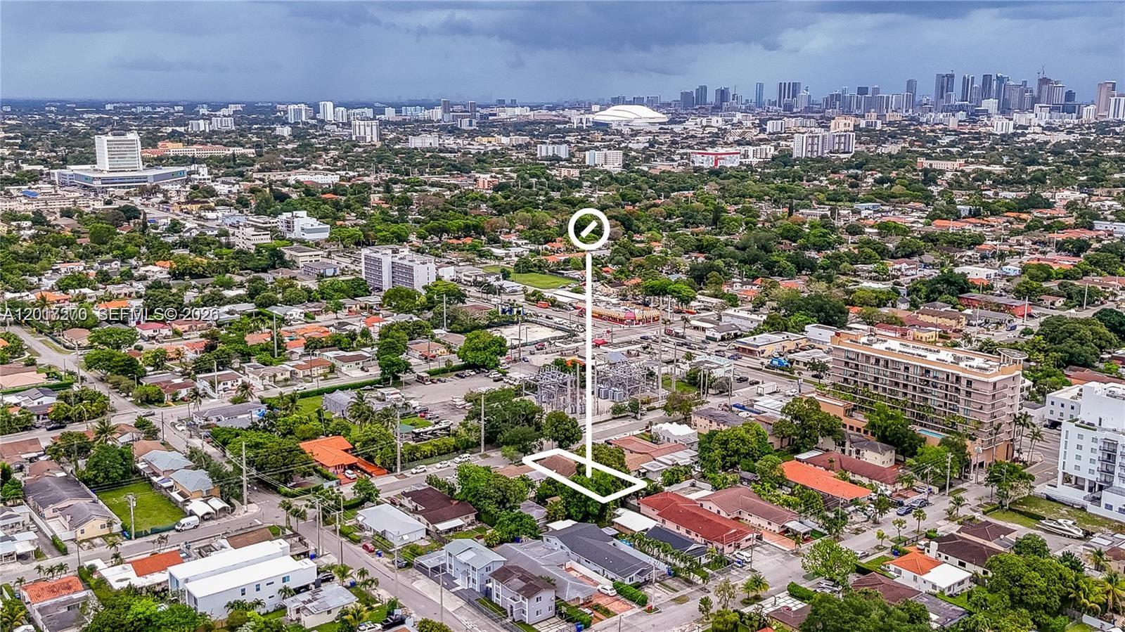 An aerial view shows a residential neighborhood with a highlighted property and distant city skyline — 2800 SW 16th Ter, Miami FL 33145, MIAMI, FL