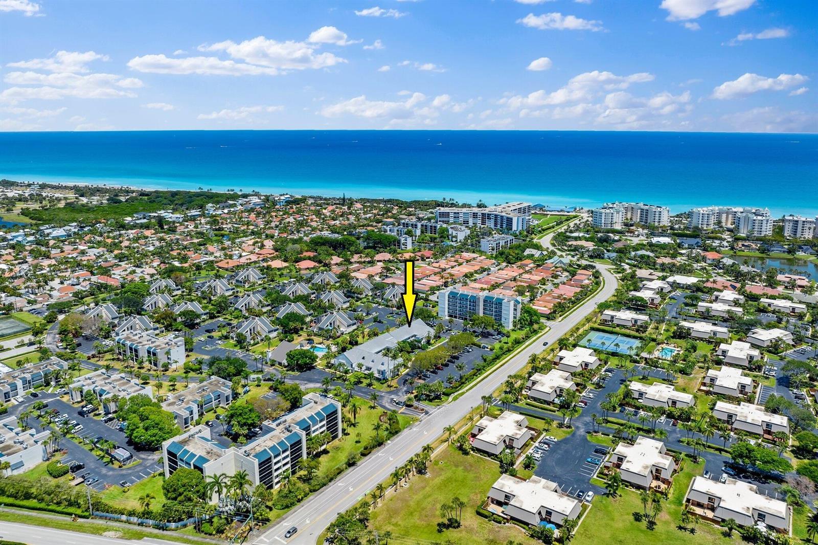 An aerial view shows a residential complex with a yellow arrow pointing to a building — 1605 S Us Hwy 1, Jupiter FL 33477, JUPITER, FL