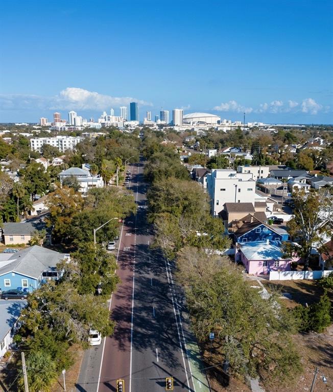 An aerial view shows a city skyline in the distance behind a residential street — 2762 1ST AVENUE S, ST PETERSBURG, FL