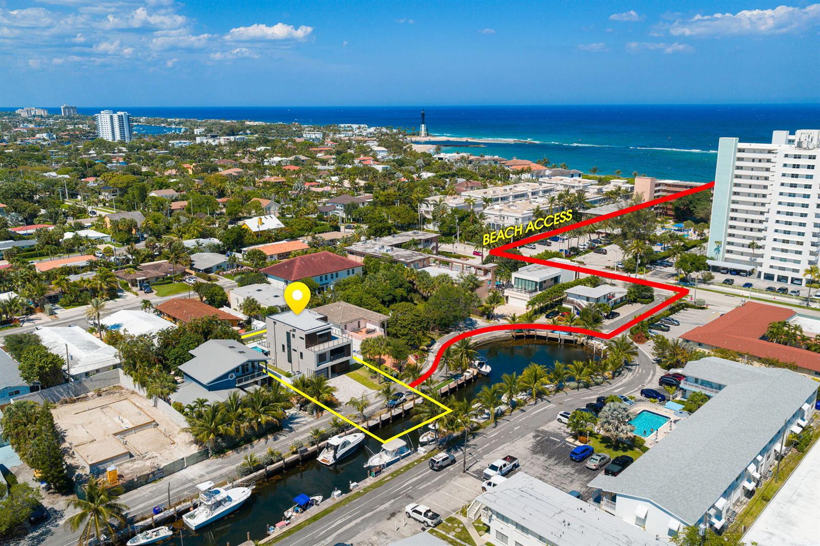 An aerial view shows a modern house on a canal with a marked beach access path — 3225 Canal Drive, Pompano Beach FL 33062, POMPANO BEACH, FL