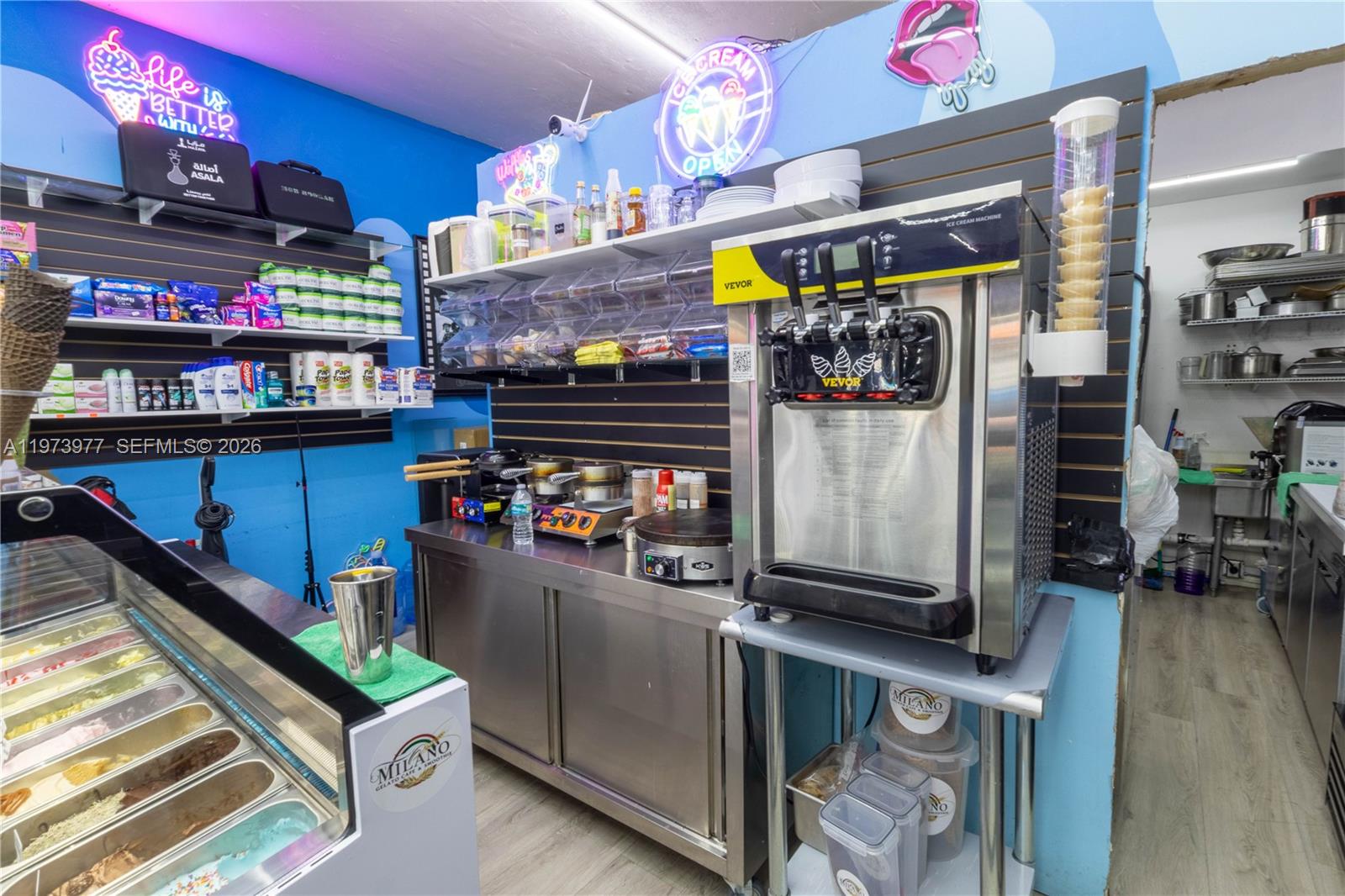 An ice cream shop interior features a soft-serve machine, gelato display case, and stainless steel counters — 700 SW 17th Ave, Miami FL 33135, MIAMI, FL