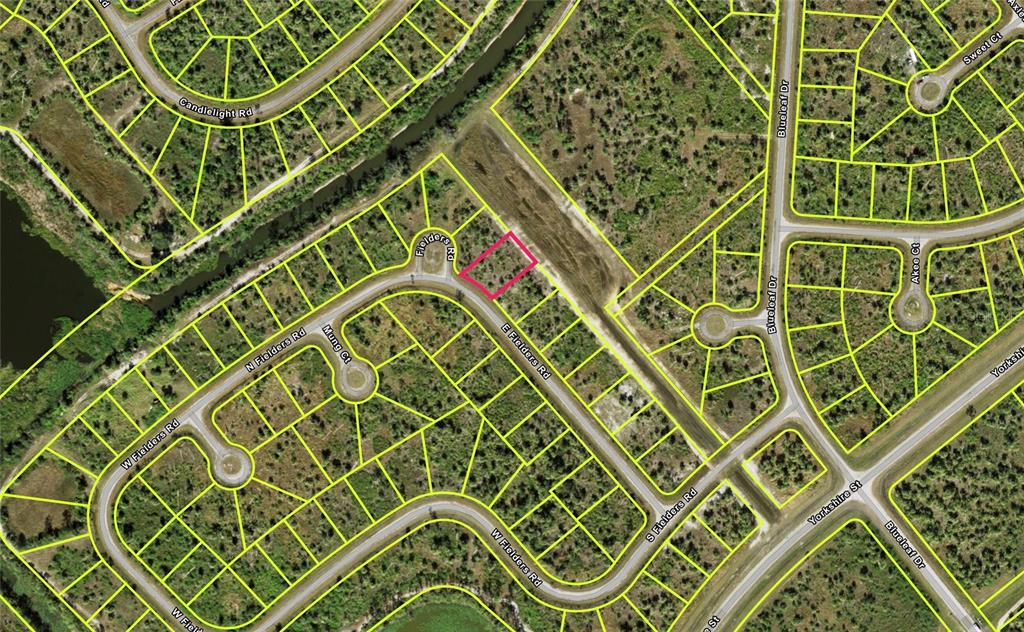 This is a satellite map view of a residential neighborhood highlighting a vacant lot — FIELDERS ROAD, NORTH PORT, FL