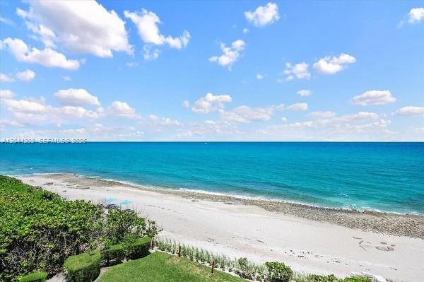 An elevated view of a sandy beach and turquoise ocean under a blue sky — 4200 N Ocean Dr # 1103, Riviera Beach FL 33404, RIVIERA BEACH, FL